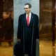 Photo of a Goldman Sachs guy ascending a golden elevator: AP